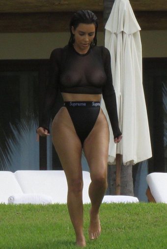 Kim Kardashian with sheer top and sexy bikini bottom