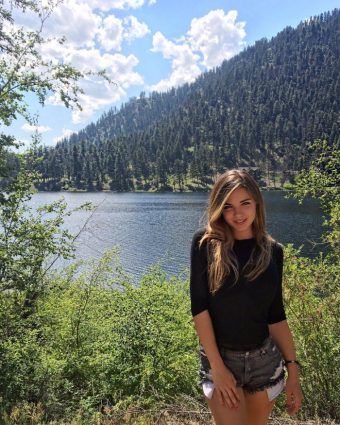 pretty girl with shorts in beautiful landscape
